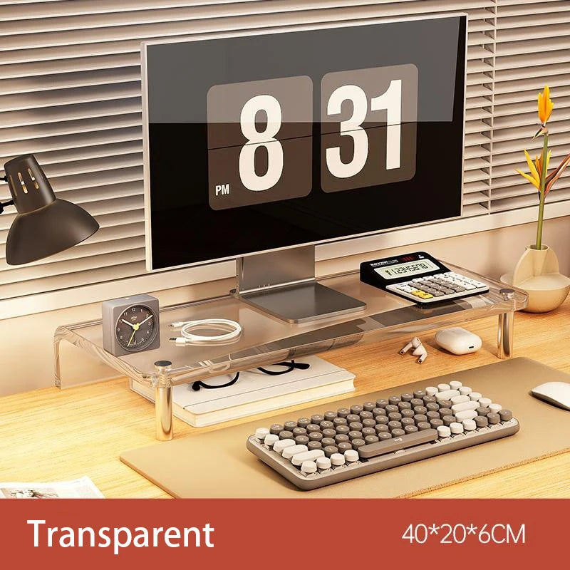A transparent acrylic desk organizer stand with metal legs, shown holding a monitor, keyboard, mouse, and other desk accessories on a wooden desk. The image includes text overlays reading 'Transparent' and '40*20*6CM' at the bottom.